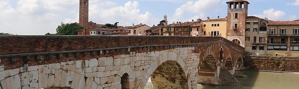Stone bridge on the Adige river in Verona, to visit during a transfer tour from Venice to Milan with a professional English speaking driver, Pantarei Chauffeur service
